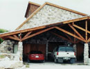 Timber-framed carport with two vehicles