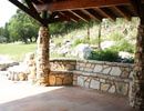 Covered stone porch overlooking the grounds