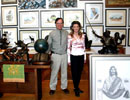 Max and Sherry Greiner standing among artwork in their studio