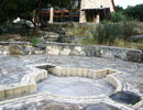 Stone prayer patio and low surrounding walls