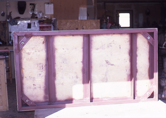 Underside of the sculpture's rectangular base showing structural supports