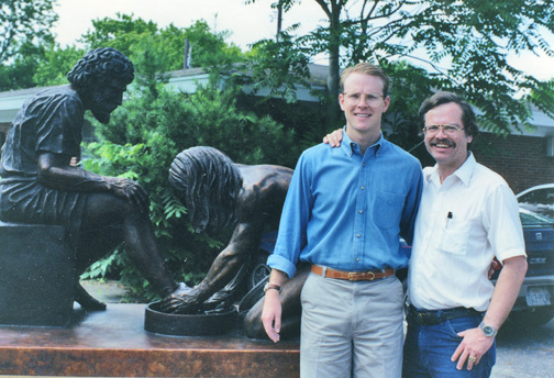Two men posing beside Divine Servant® outdoors