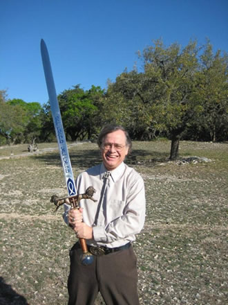 Max Greiner holding a long sword outdoors