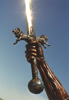Bronze hand gripping the sword, with sunlight reflected along the blade