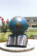 The Great Commission® sculpture: a globe above an open Bible